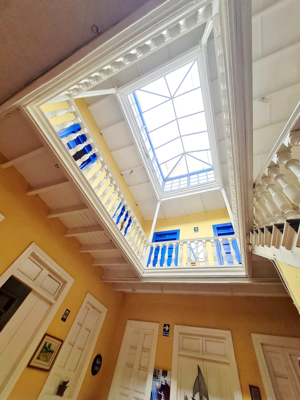 The skylight of the old house over the courtyard, with the wooden balustrade around it