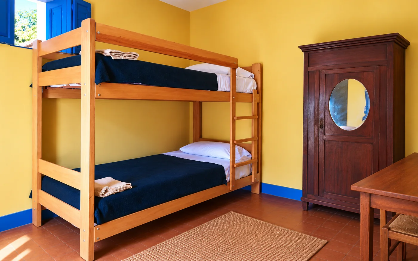 Double room in the historic house, with bunk beds and the wooden wardrobe