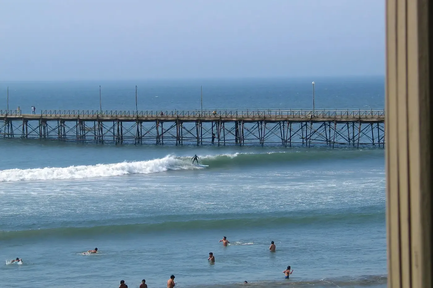 The seafront wave breaking in front of the town beach