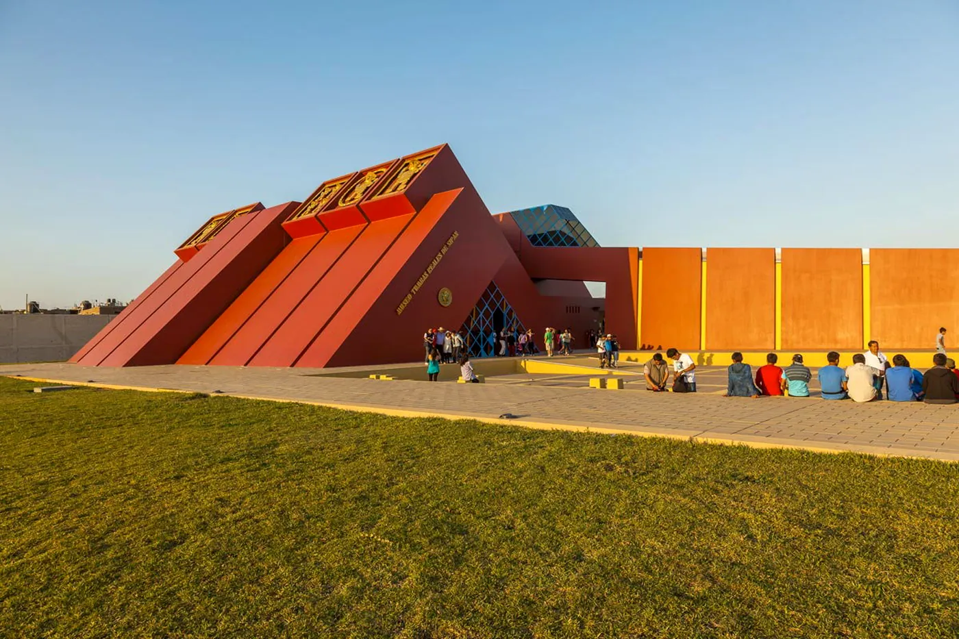 Façade of the Royal Tombs of Sipán Museum, shaped like a red pyramid