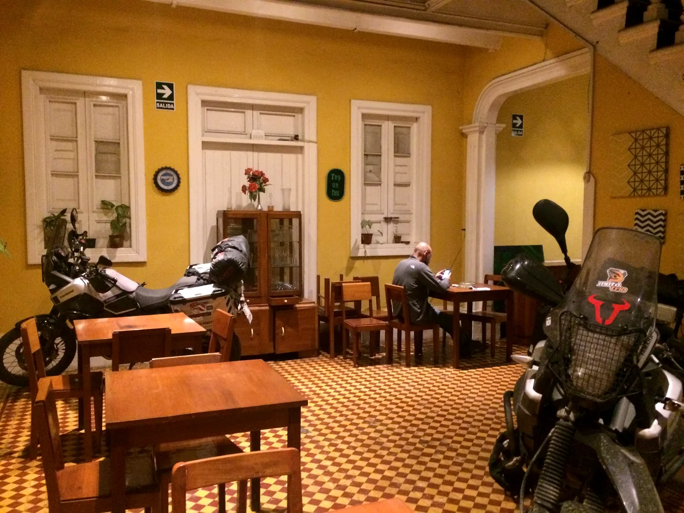 Travel motorbikes parked inside the dining room of the old house